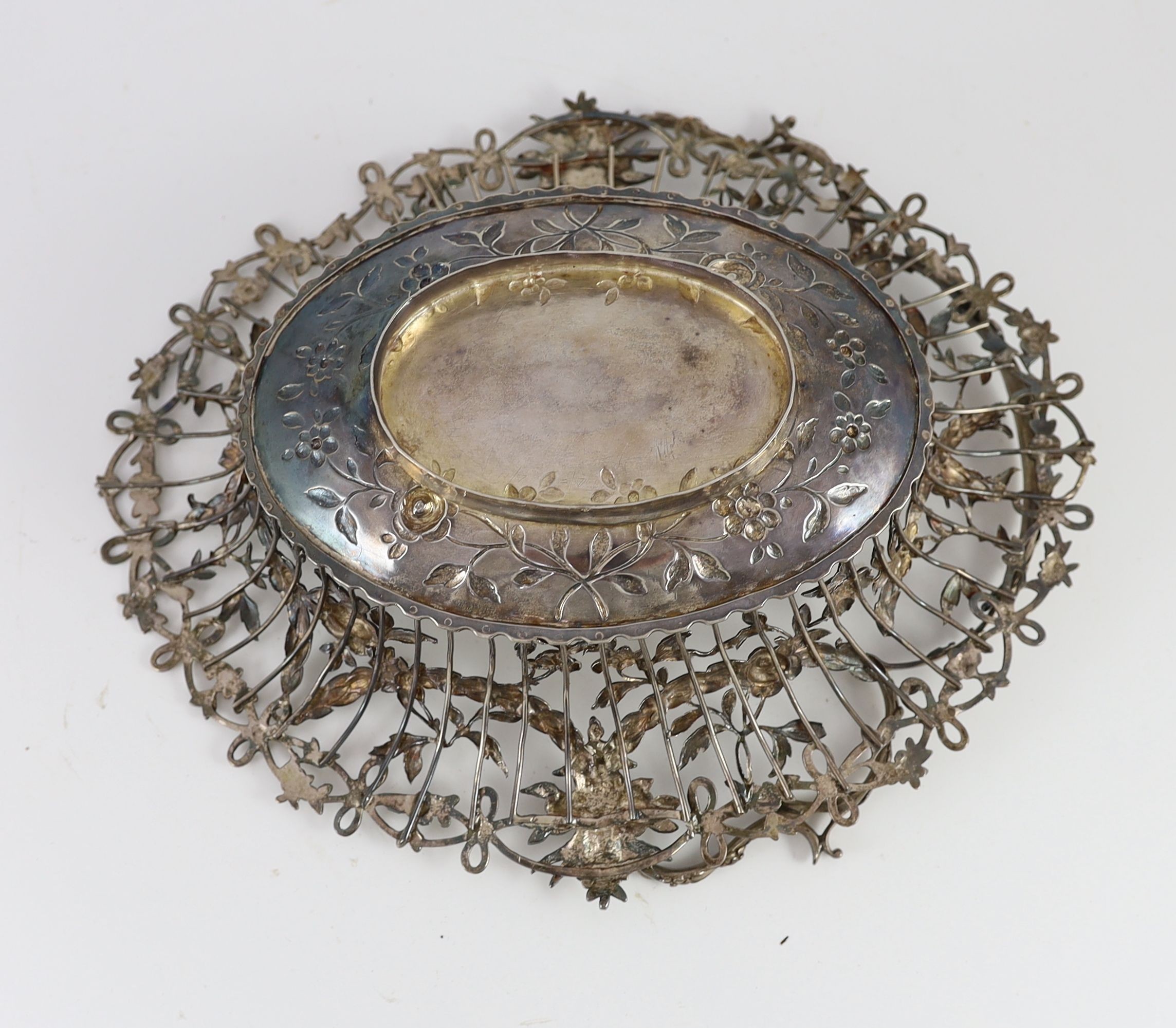 A George III pierced silver oval epergne basket, by Vere & Lutwyche, engraved with the Heneage family crest